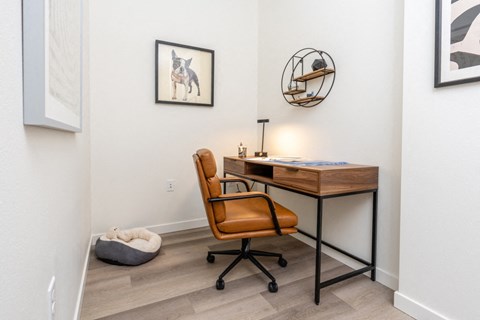 A room with a desk and chair.