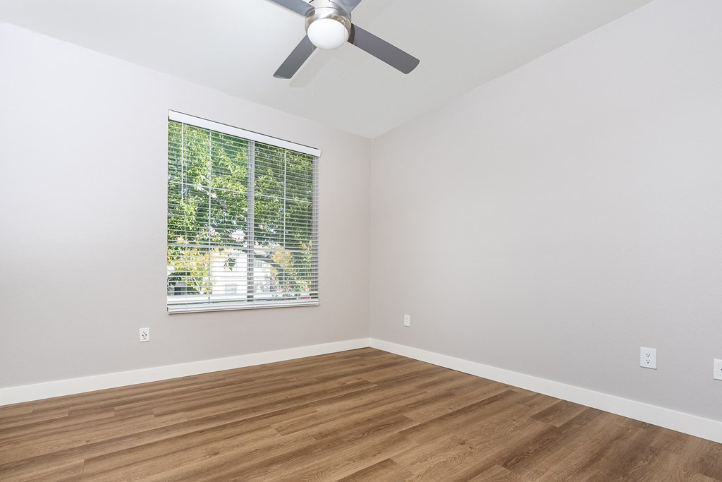 Apartments in Spring Valley, NV, for Rent - Alicante - Bedroom with Hardwood-Style Floor, Spacious Closet, and Large Window with Blinds