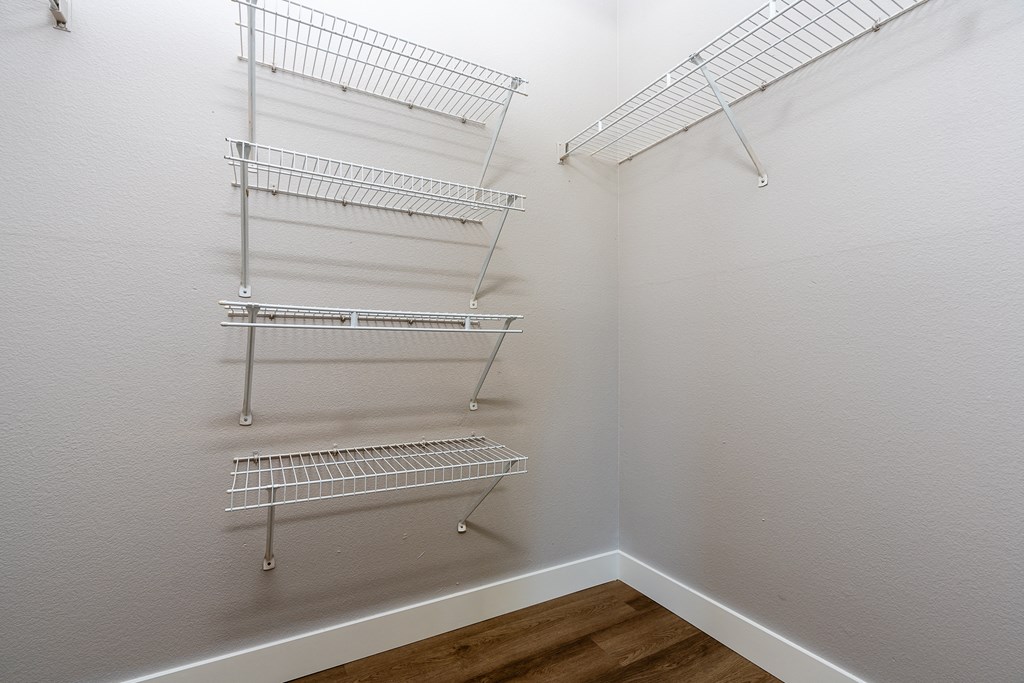 our spacious closets are equipped with shelves and hooks for hanging clothes