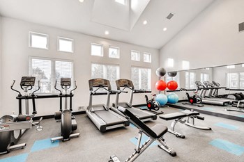 Apartments For Rent in Denver CO - Allure Apartments Fully EquippedFitness Center With Windows And Mirrored Wall - Photo Gallery 5