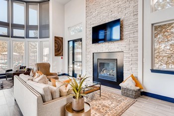 Denver, CO Apartments for Rent- Allure- Clubroom with Fireplace and Floor-to-Ceiling Windows - Photo Gallery 4