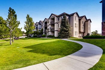 Apartments for Rent Denver CO - Allure - Exterior Apartment Building with Beige Siding and Lush Landscaping - Photo Gallery 14