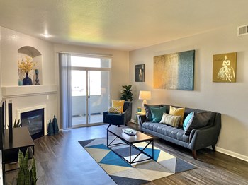 Apartments for Rent in Denver CO - Allure - Spacious Living Room with Hardwood Floors, Fireplace, and Sliding Glass Door - Photo Gallery 10