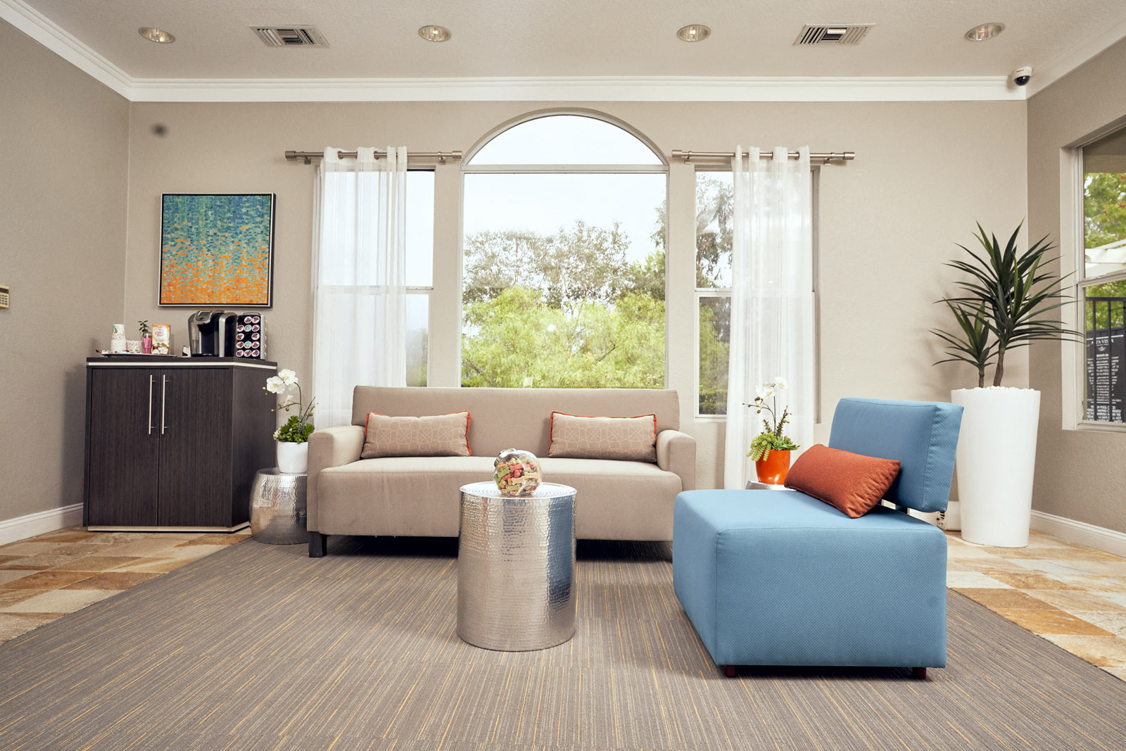 a living room with a couch and a chair