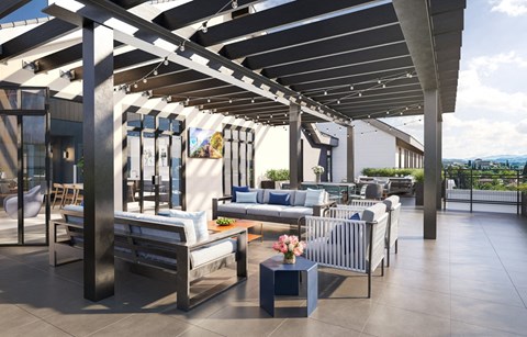a lounge area with couches and tables under a roof