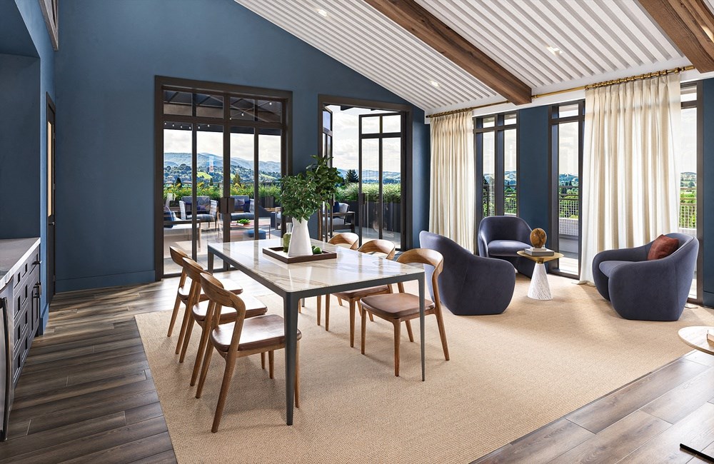 a dining room with blue walls and a table with chairs