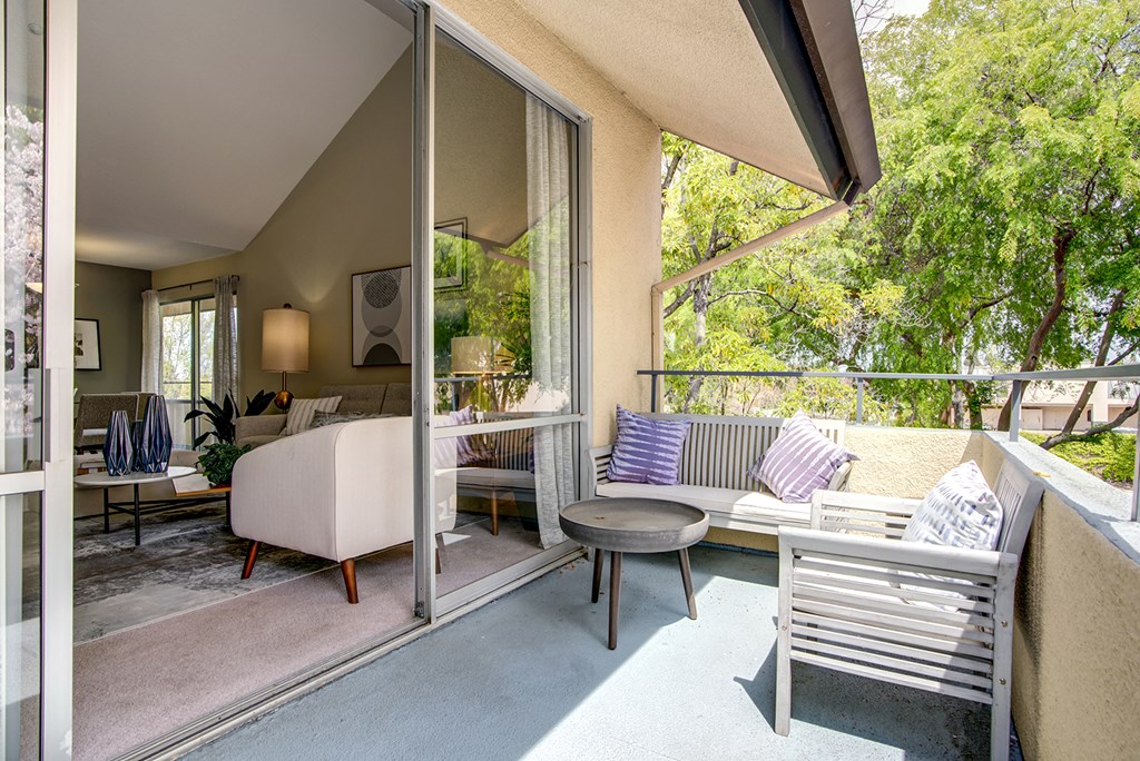 Sliding glass doors to patio from living area at Americana Apartments, Mountain View, 94040