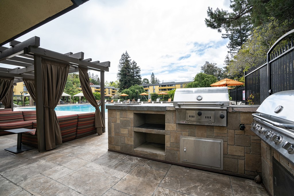 Outdoor grill and seating area at Americana Apartments, Mountain View, CA