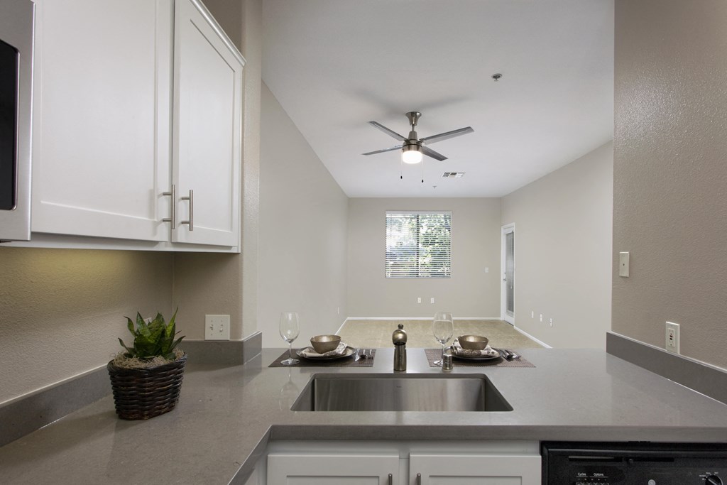 a kitchen with a sink and a ceiling fan at 55+ Remington at Ladera Ranch, Ladera Ranch, 92694