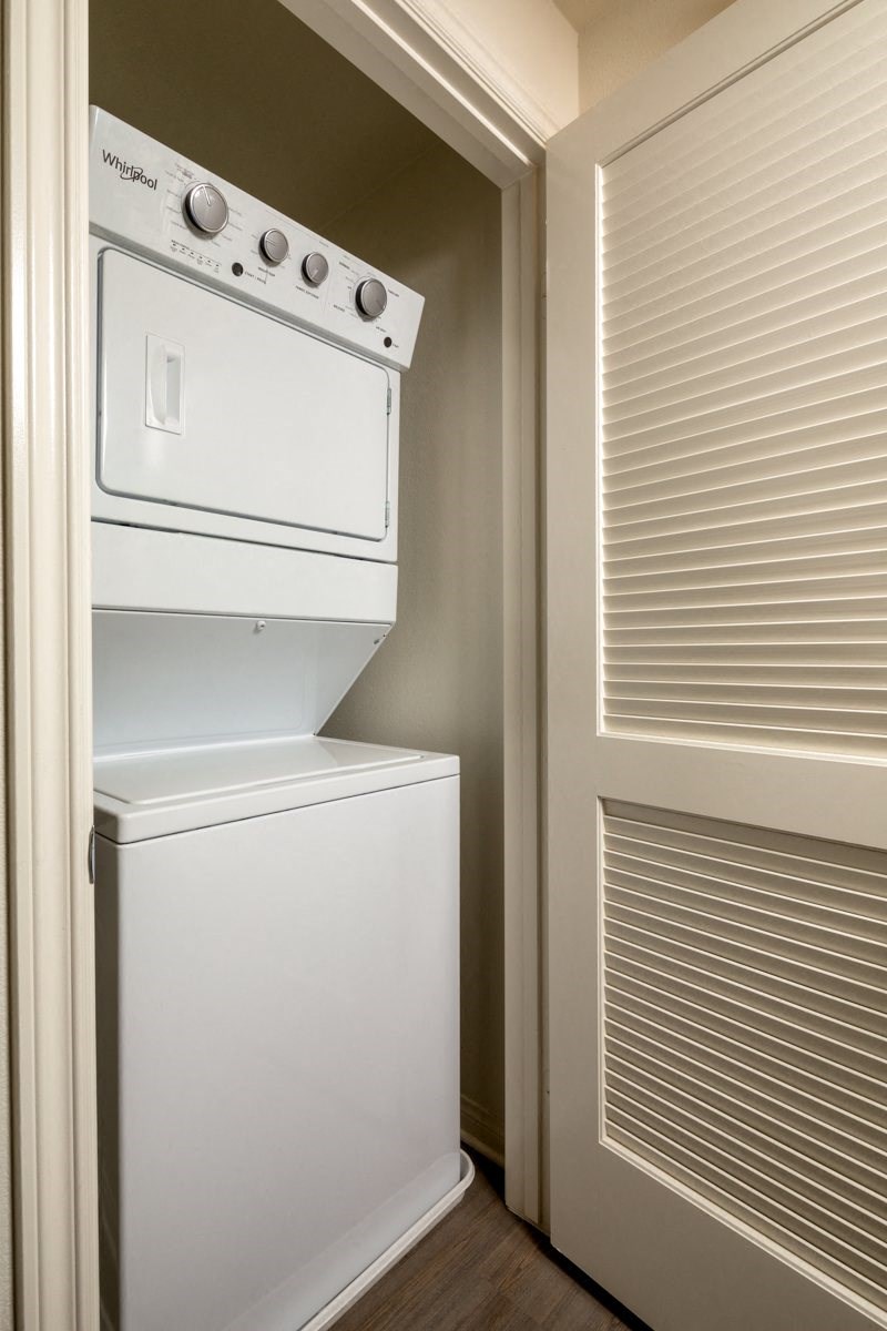 a washer and dryer in a room next to a door