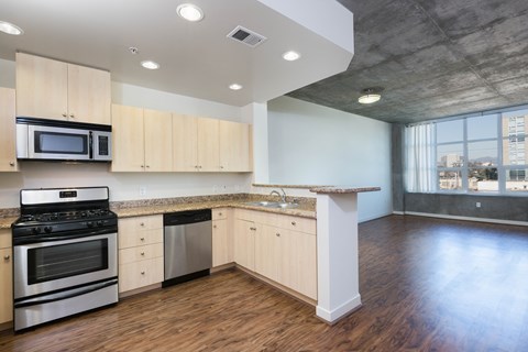 kitchen with stainless steel appliances at Aqua Via Apartments, Oakland, 94607