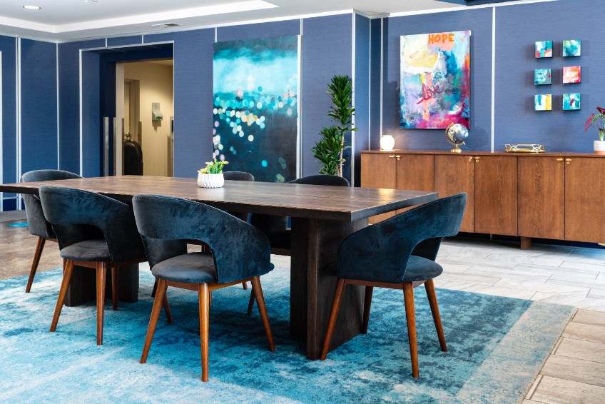 furnished lobby with long table and lounge seating furnished lobby with long table and lounge seating at Aqua Via Apartments, California, 94607