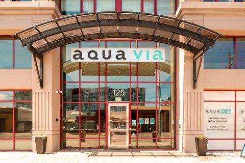 Aqua via entry way with property sign at Aqua Via Apartments, Oakland, CA, 94607