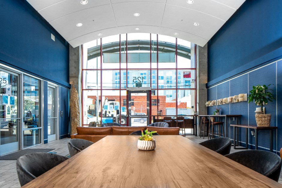 entryway lobby with long table and lounge seating