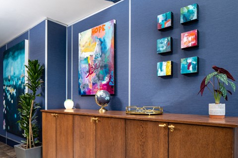 furnished lobby with globe and artwork at Aqua Via Apartments, Oakland