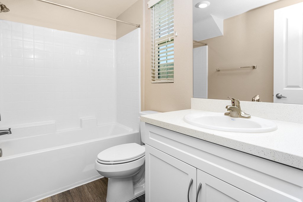 a bathroom with a sink toilet and bathtub