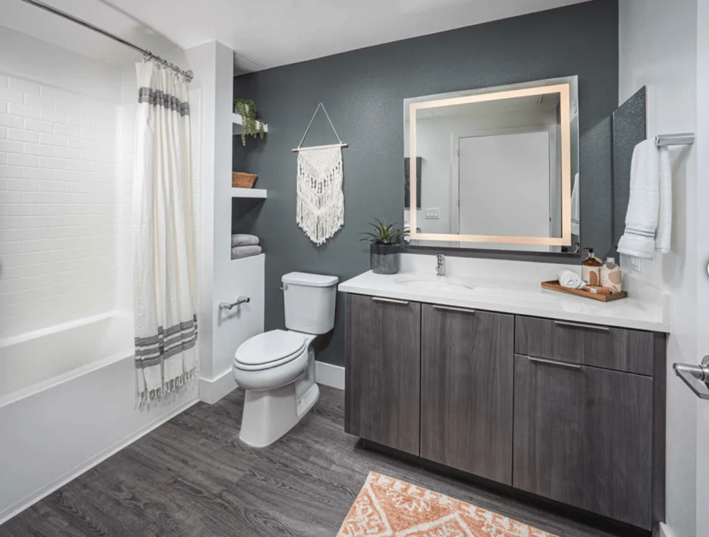 bathroom with white toilet, bathtub and sink
