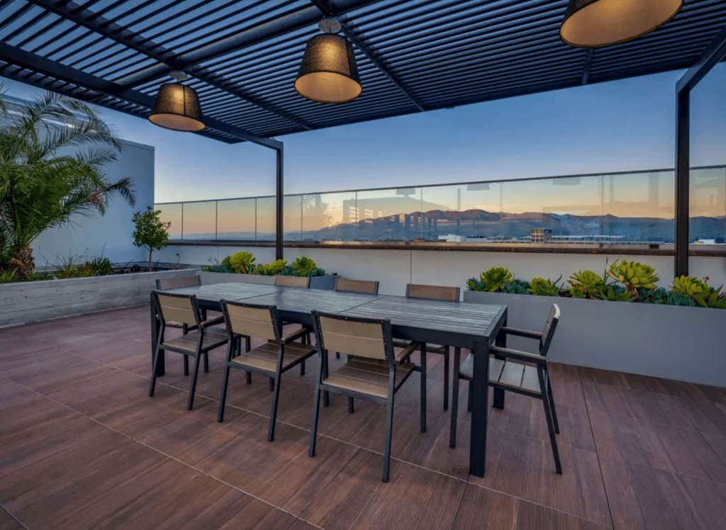 a patio with a table and chairs on a balcony