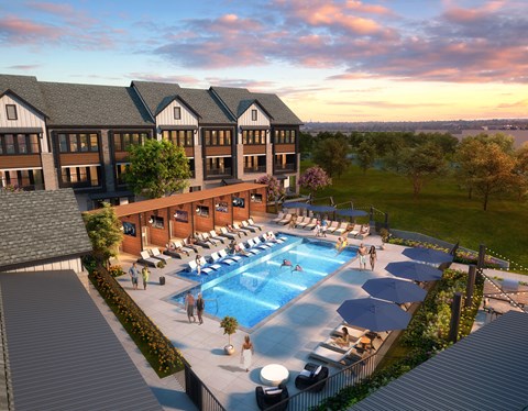 A large building with a pool in front of it.