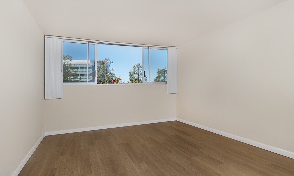 jefferson floor plan unfurnished bedroom with wood style plank flooring at Avenue Two Apartments, Redwood City  ,California, 94063