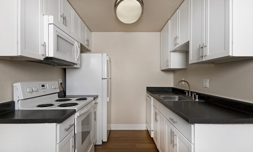 jefferson floor plan kitchen with white cabinets at Avenue Two Apartments, California