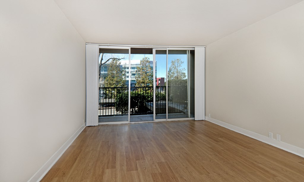 jefferson floor plan unfurnished living room and wood plank style flooring at Avenue Two Apartments, Redwood City
