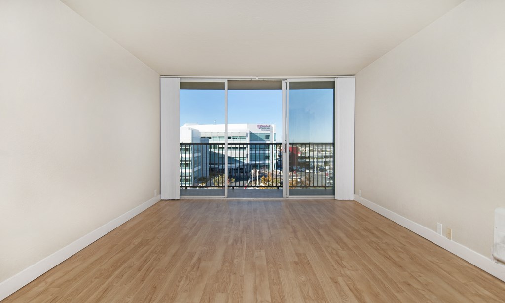 seaport unfurnished living room with wood plank style flooring at Avenue Two Apartments, Redwood City  , CA
