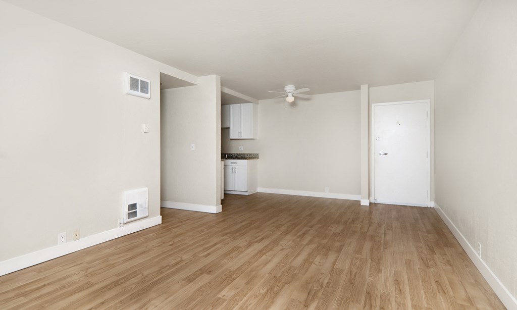 seaport unfurnished living room with wood plank style flooring at Avenue Two Apartments, Redwood City