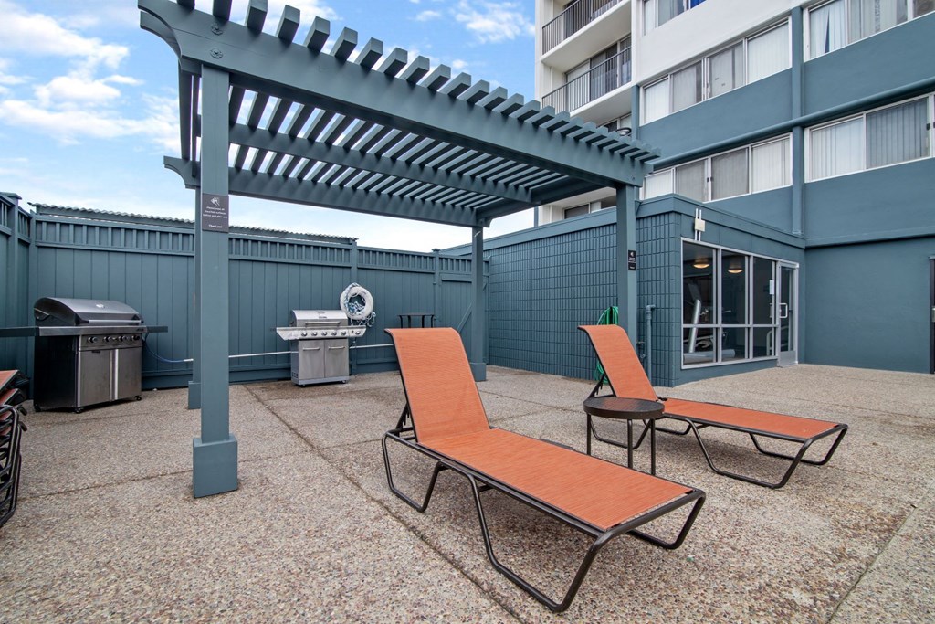 avenue two lounge chairs and grill area at Avenue Two Apartments, Redwood City  , CA 94063