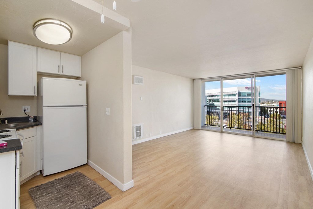 ralston floor plan unfurnished kitchen and living room area at Avenue Two Apartments, Redwood City  , CA