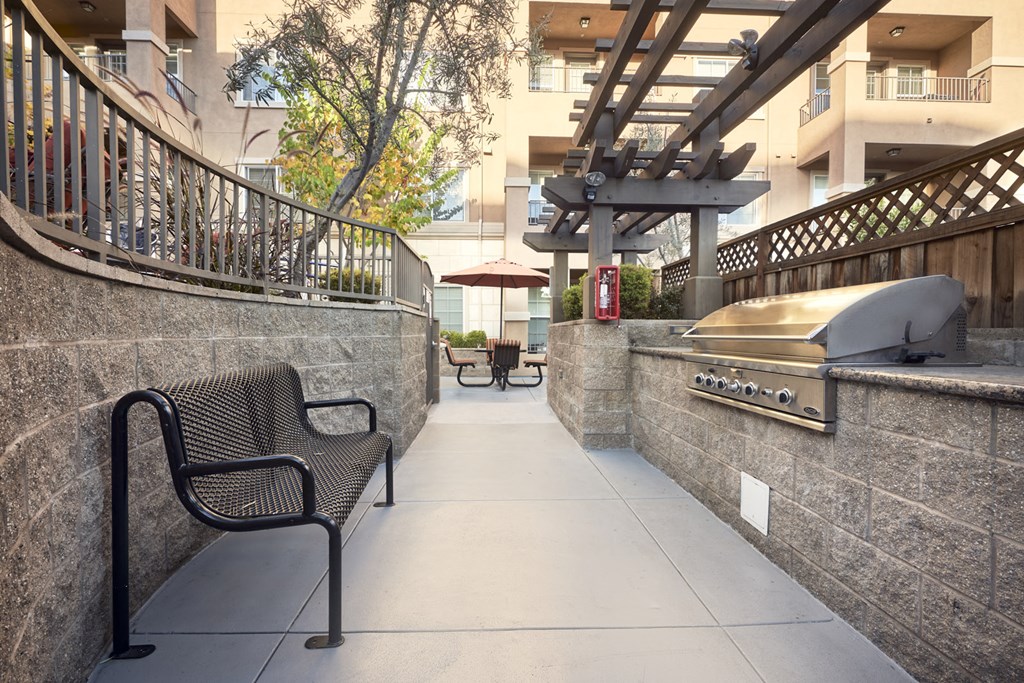 Apartments in San Jose, CA - Aviara - BBQ and Picnic Area with a Grill, Bench, and Seating Area