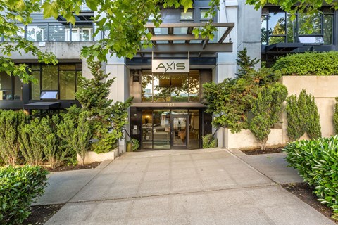 The image shows the entrance to a building with the sign