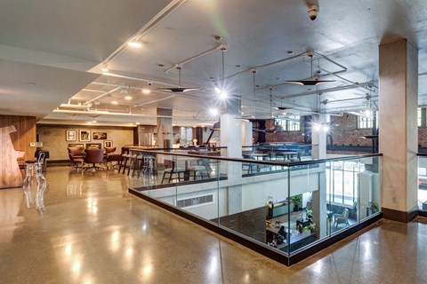 a large room with a table and chairs and a glass display case