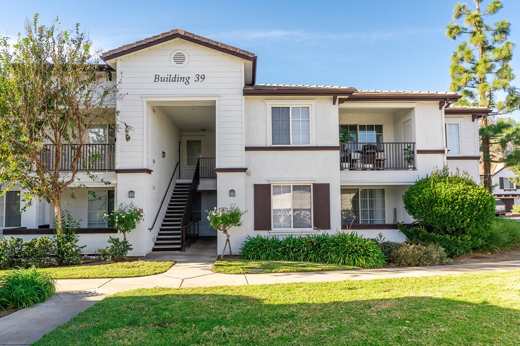 Rancho Cucamonga, CA Apartments - Exterior View of Barrington Place Apartments Building Surrounded By Lush Landscaping