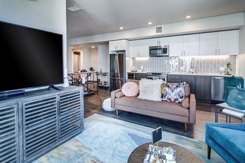 a living room with a couch and a tv