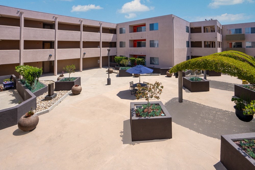 a view of the courtyard of an apartment building from above