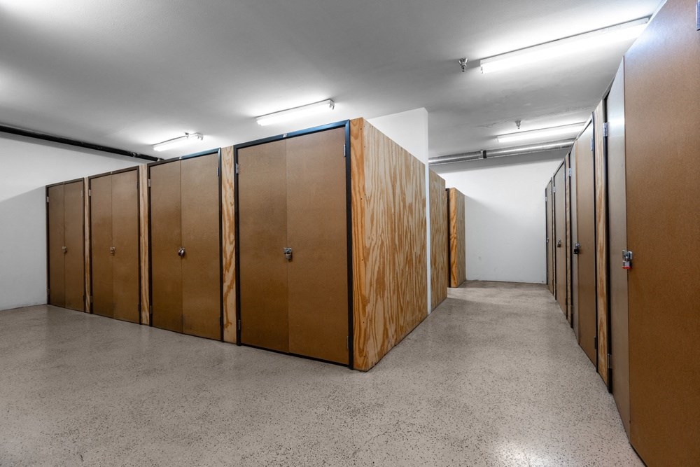 a row of wooden wardrobes in a room
