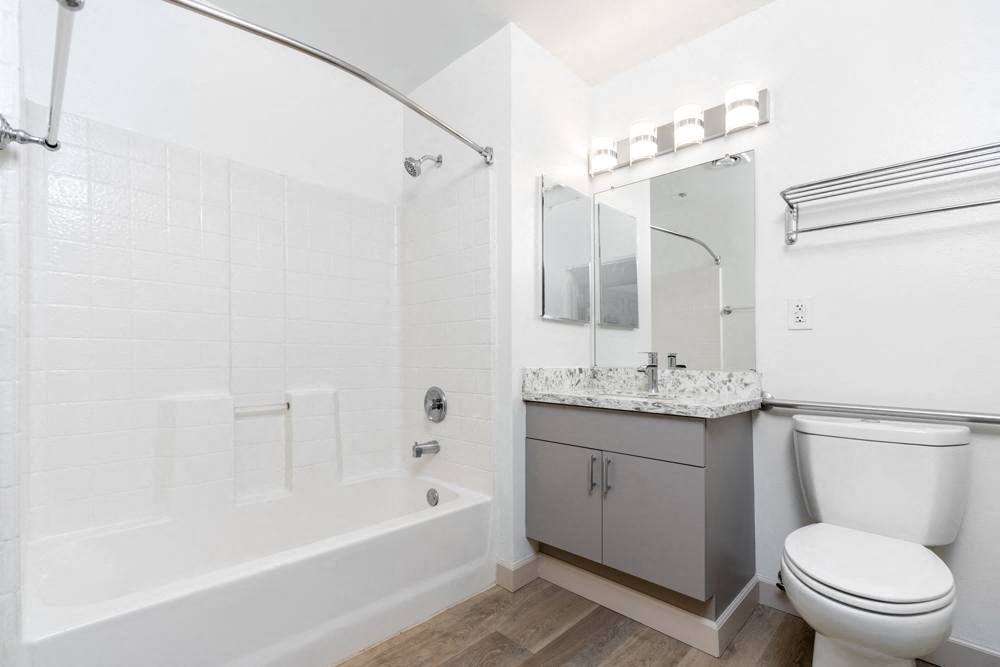 a bathroom with a toilet and a tub