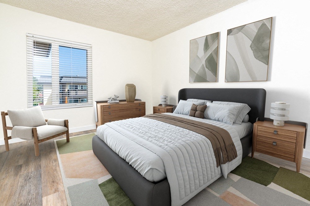 a bedroom with a large bed and a window