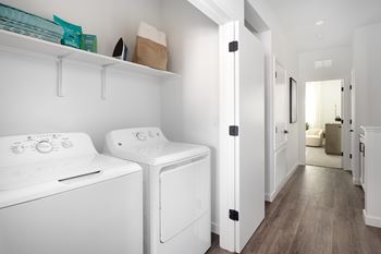 A laundry room with a washer and dryer.