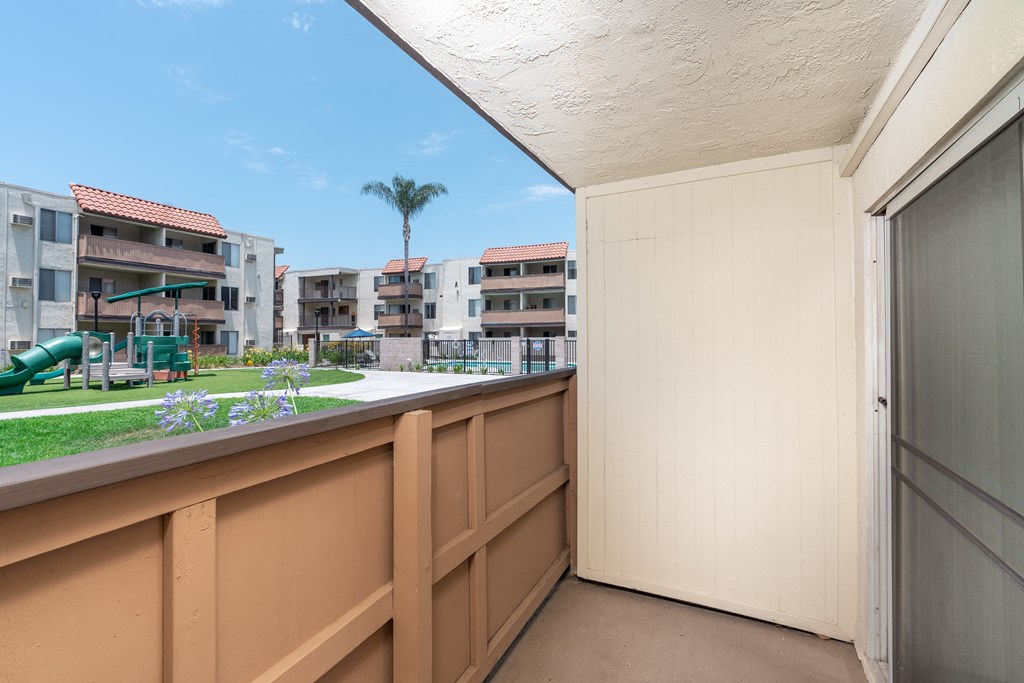 Balcony overlooking exterior lawn area