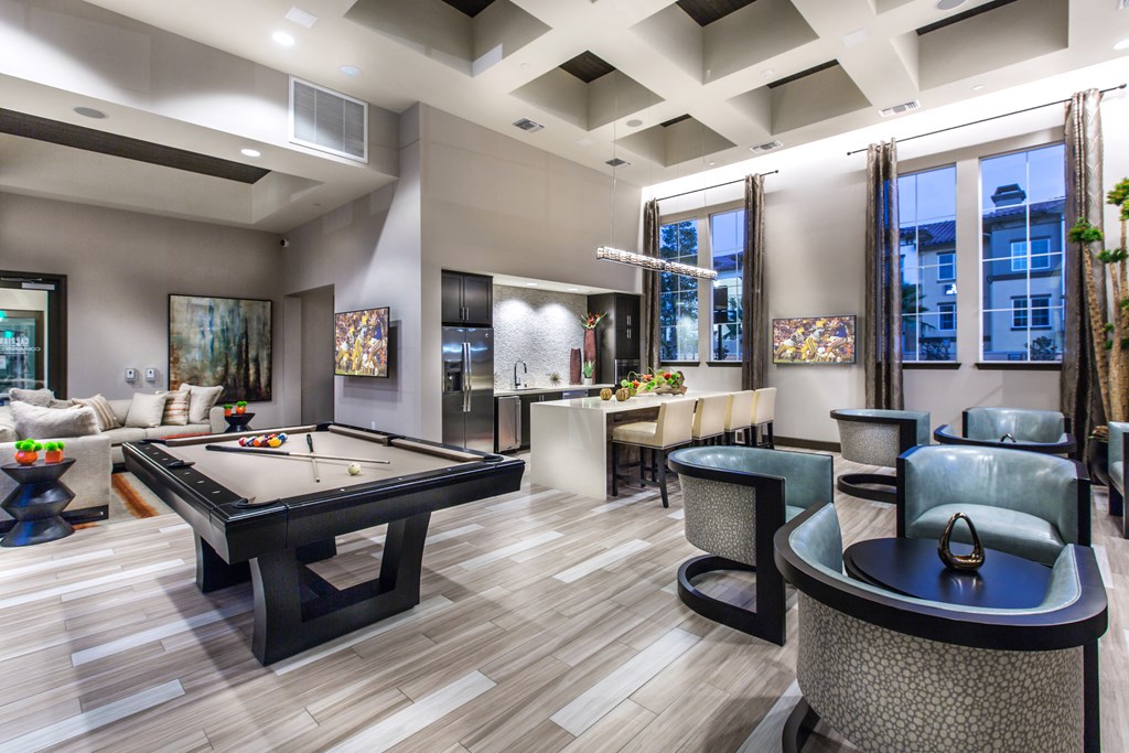 resident lounge with pool table and open kitchen