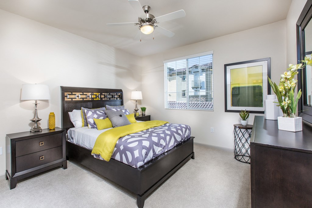 1 BR Apartments in Chino Hills, CA - Capriana at Chino Hills - Bedroom with Plush Carpeting and a Ceiling Fan