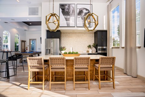 A modern dining room with a wooden table and chairs at Capriana at Chino Hills, California, 91709