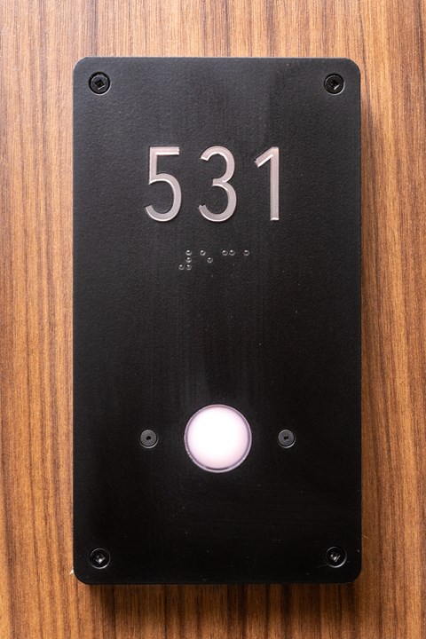 A black door plate with the number 531 on it.