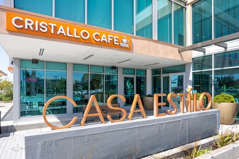 The Cristallo Cafe is located in a modern building with a glass facade.