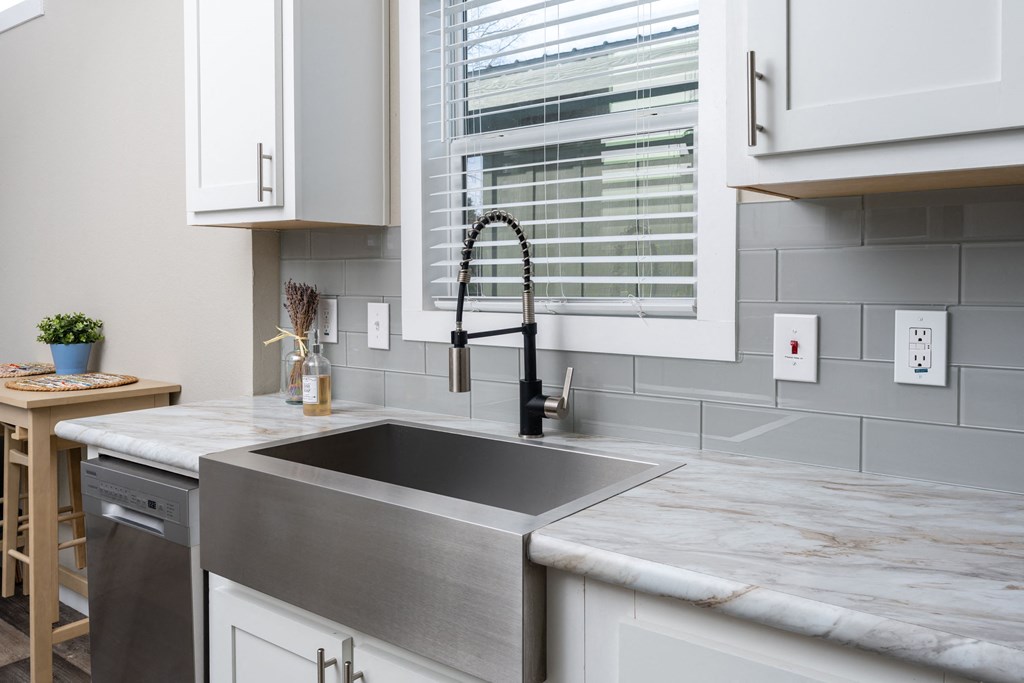 a kitchen with a sink and a window