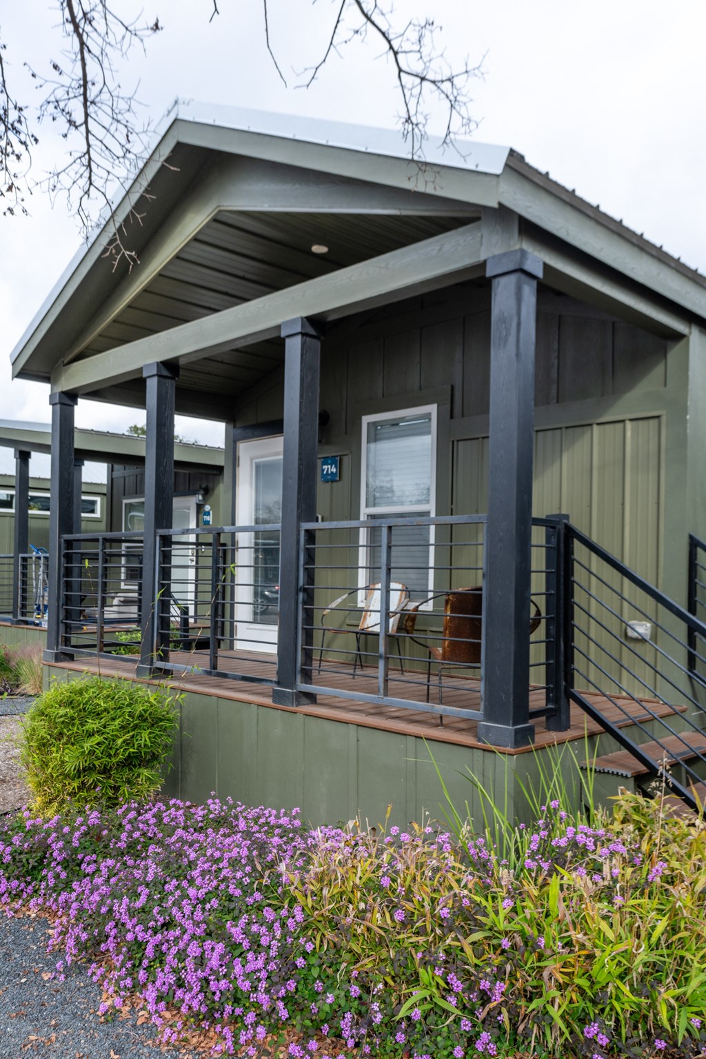 a house with a porch and a table and chairs on it