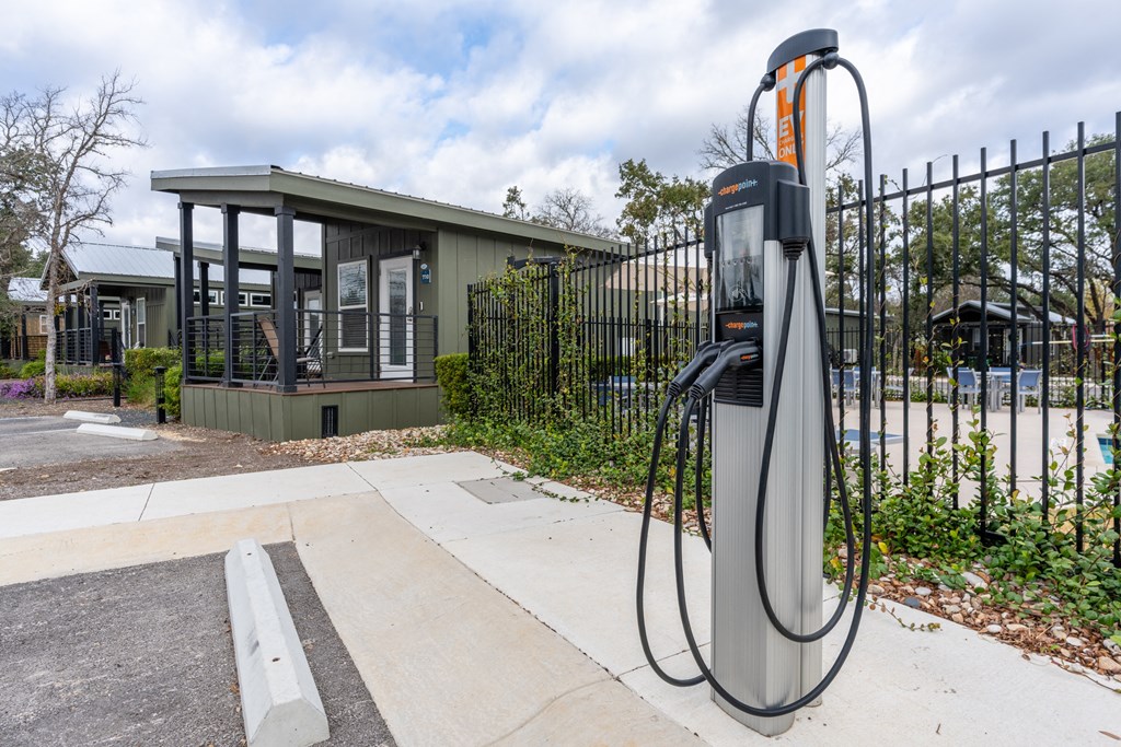 a gas pump in front of a house
