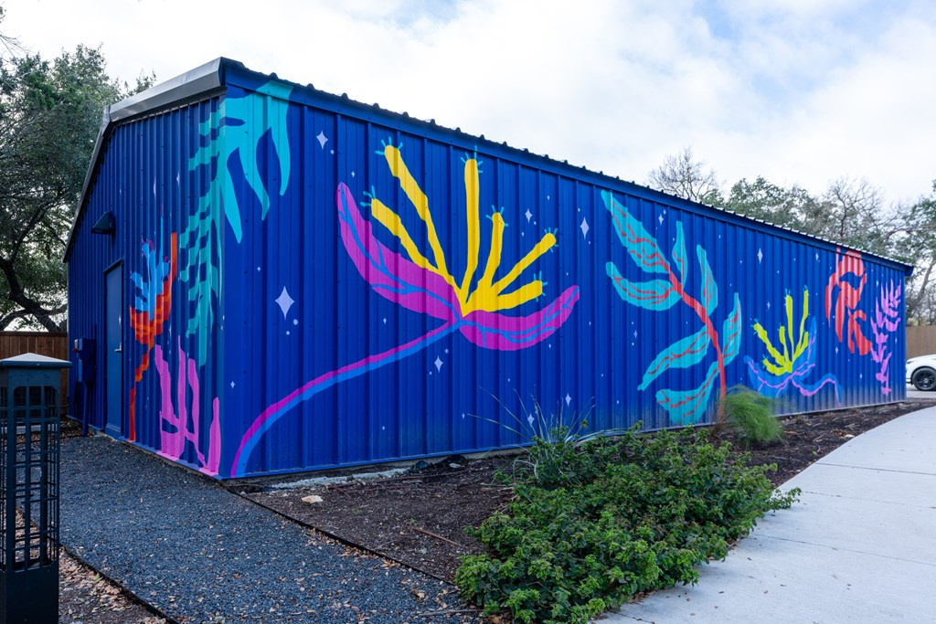 the side of a building with graffiti on it